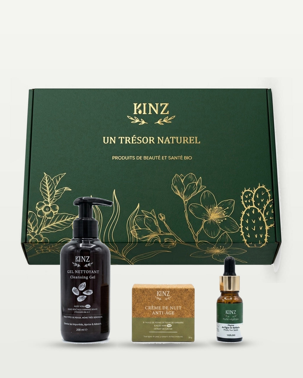 باقة Kinz الأساسية لمكافحة الشيخوخة أمام علبتها الخضراء: جل التنظيف، كريم الليل المضاد للشيخوخة وزيت بذور التين الشوكي
